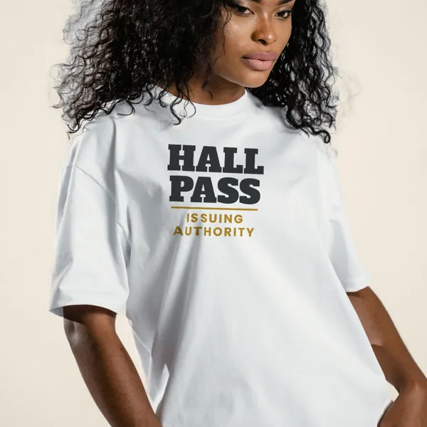 Model wearing a white "Hall Pass Issuing Authority" graphic tee, front view